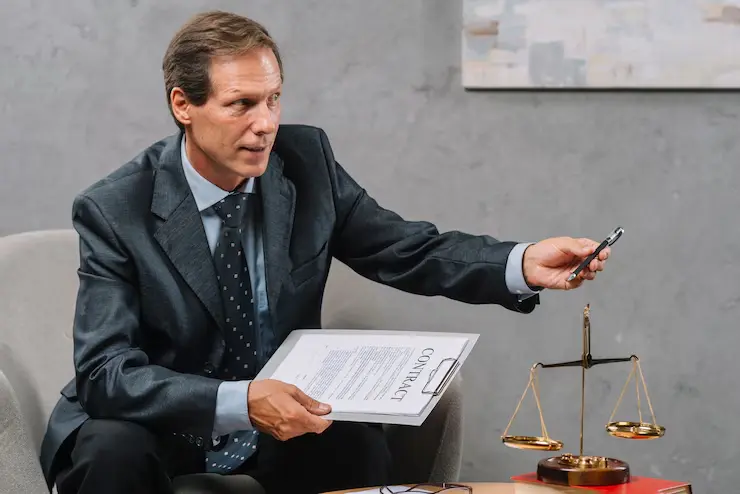 Top close-up-mature-male-adviser-holding-contract-hand-giving-pen